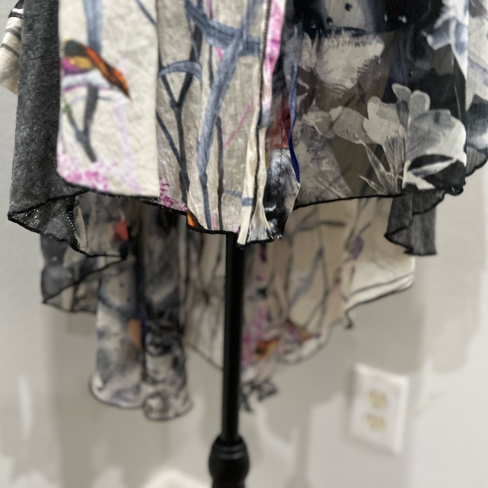 Unique top from a boutique!  Worn 1 time and dry cleaned.